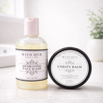 Skincare products including face wash and balm from With Love Skincare on a neutral background.